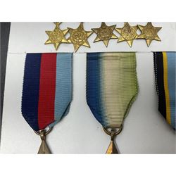 Representative display of WWII Campaign stars comprising 1939-1945 Star, Atlantic Star, Air-Crew Europe Star, Africa Star and Pacific Star; together with the corresponding group of miniatures; all with ribbons