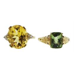 Gold oval citrine and cubic zirconia ring and a gold green stone set ring, both hallmarked 9ct
