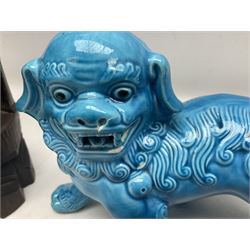 Two Chinese blue glazed Fo Dogs, and a Chinese silver-wirework inlaid figure, largest L35cm (3)