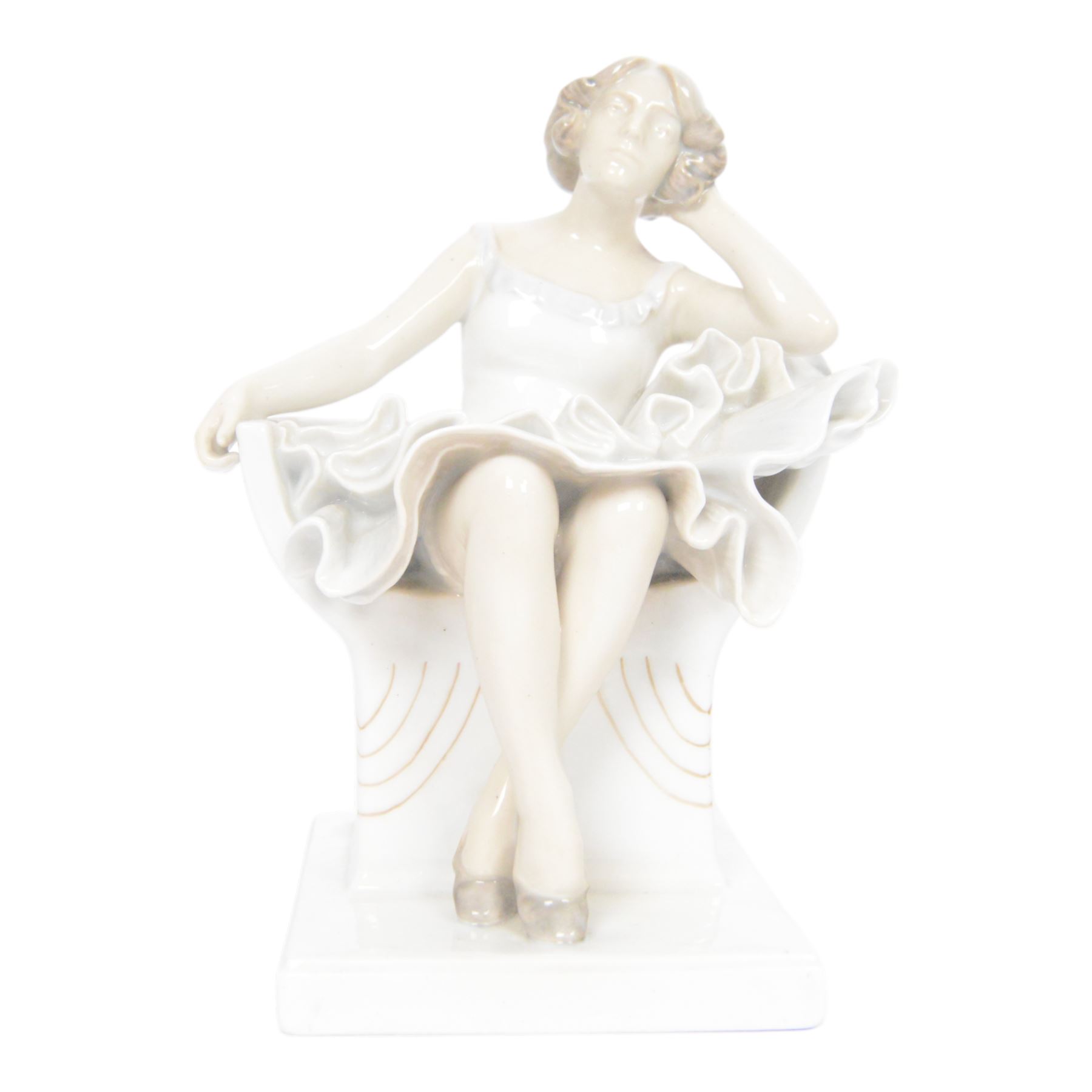 Royal Copenhagen figure no. 894, Woman Seated in a Chair, designed by Axel Locher, H20cm