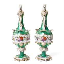 Pair of mid-19th century Jacob Petit ewers, in the Rococo Revival style, hand-painted with panels of flowers on a green ground and heightened profusely with gilt, JP mark in underglaze blue to base, H25cm