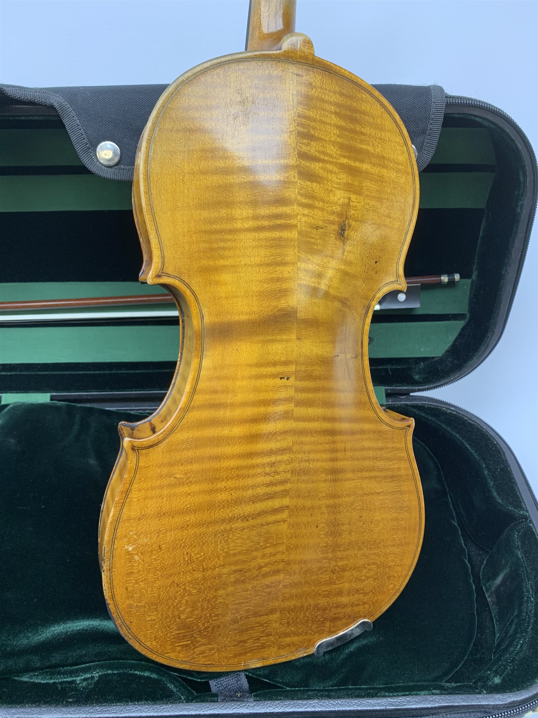 Late 19th century continental violin, possibly Italian, with 36cm two-piece maple back and ribs and spruce top, bears label 'Antonius Stradivarius Anno 1721', 60cm overall; in modern carrying case with silver mounted pernumbuco bow