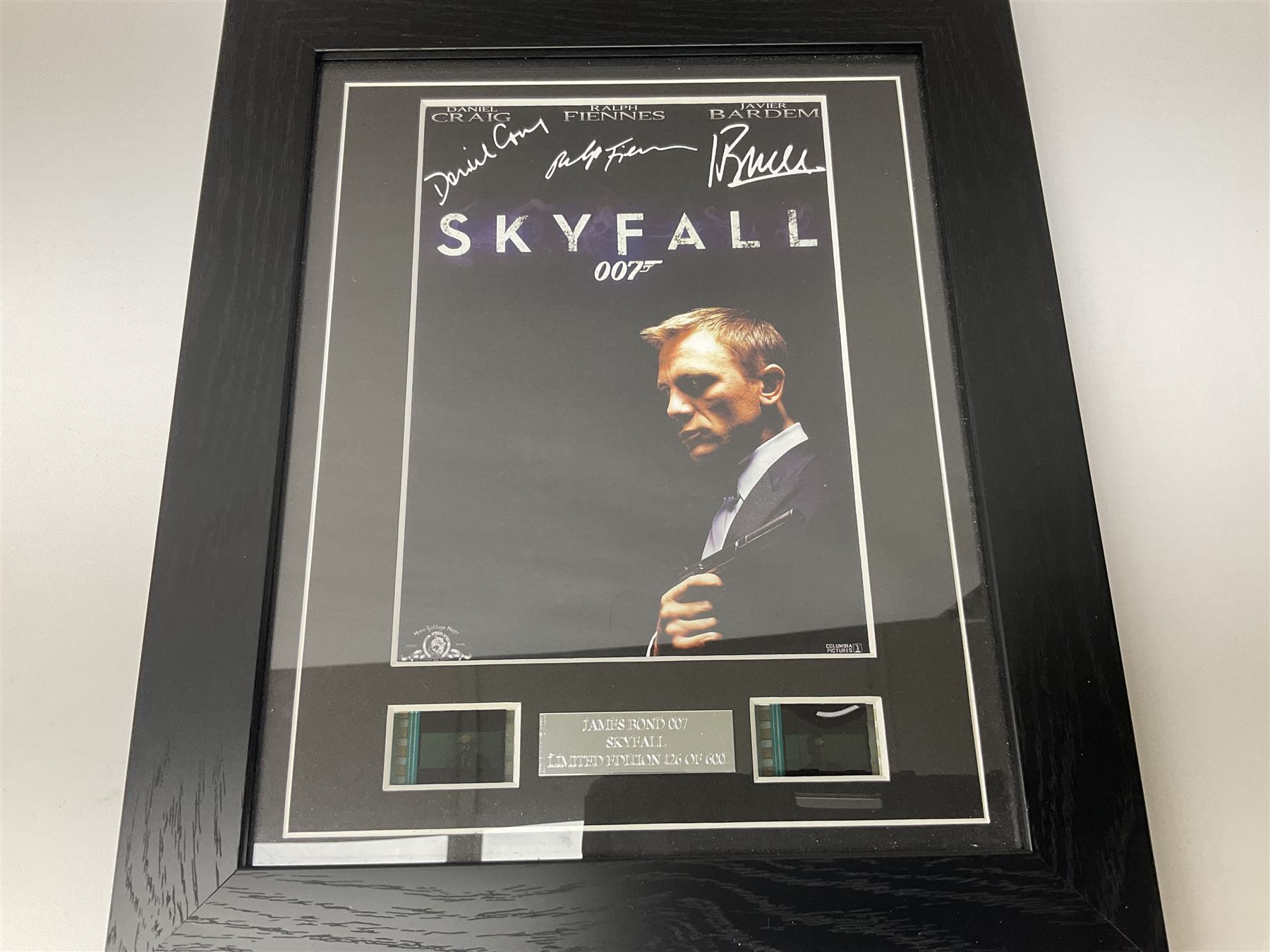 Limited edition framed James Bond 007 Skyfall print, 126/600, boxed Spectre pen, Aston Martin DB5 keyring and sealed 007 50th Anniversary Edition boxed monopoly game (4)