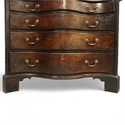 George III Chippendale period mahogany serpentine-fronted chest, shaped top with moulded edge over a deep serpentine outline with four graduated drawers, the canted corners decorated with blind-fretwork geometric decoration, fitted with brass swan-neck handles, lower moulded edge on bracket feet, circa 1760-1770
