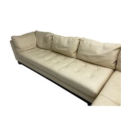 Roche-Bobois - large corner sofa, upholstered in ivory leather with buttoned seat cushions, raised on a stained beech base with bracket feet