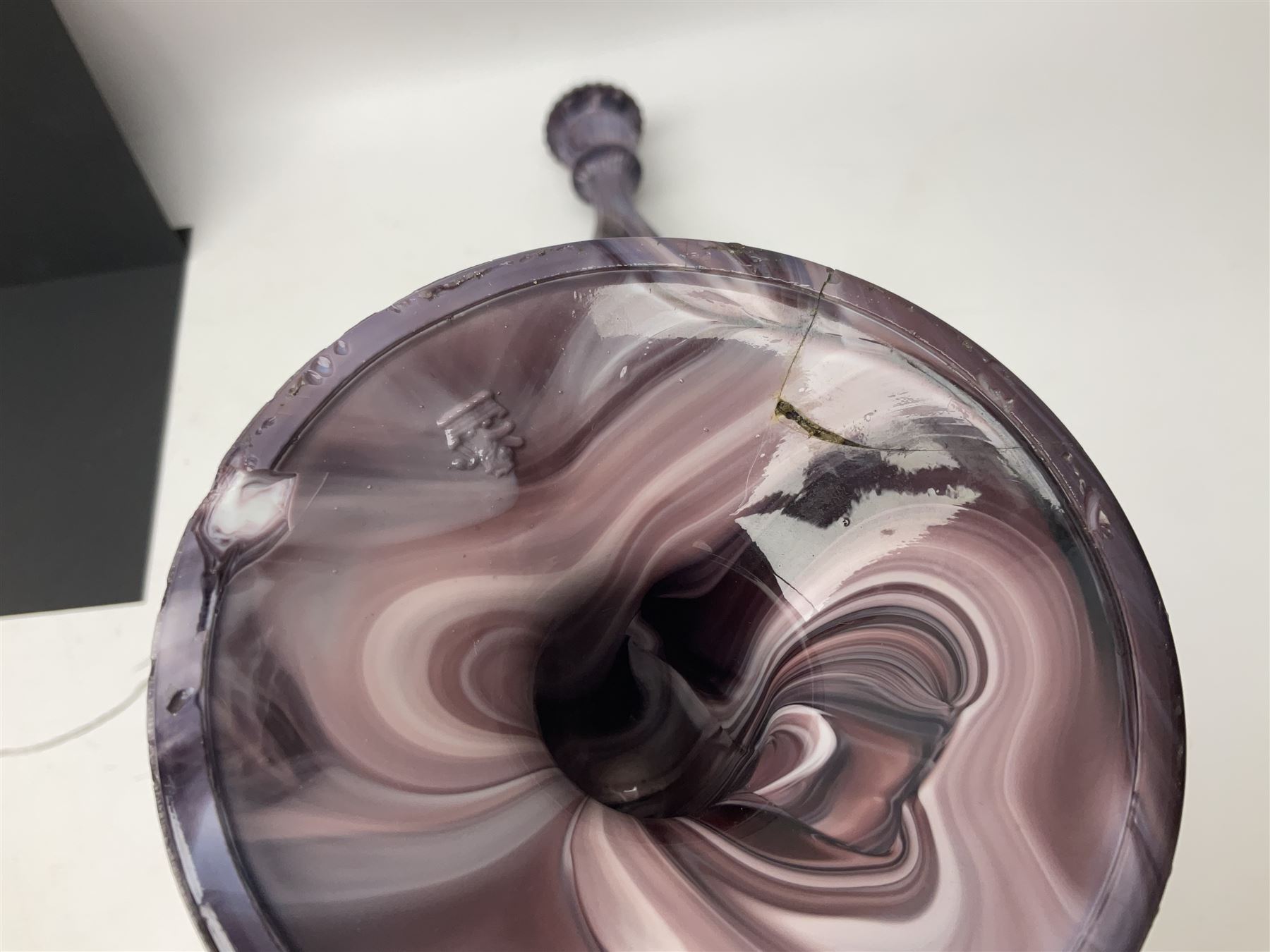 Daum glass two stemmed candle stick signed to verso, together with a pair of slag glass purple candle sticks, Daum H21cm