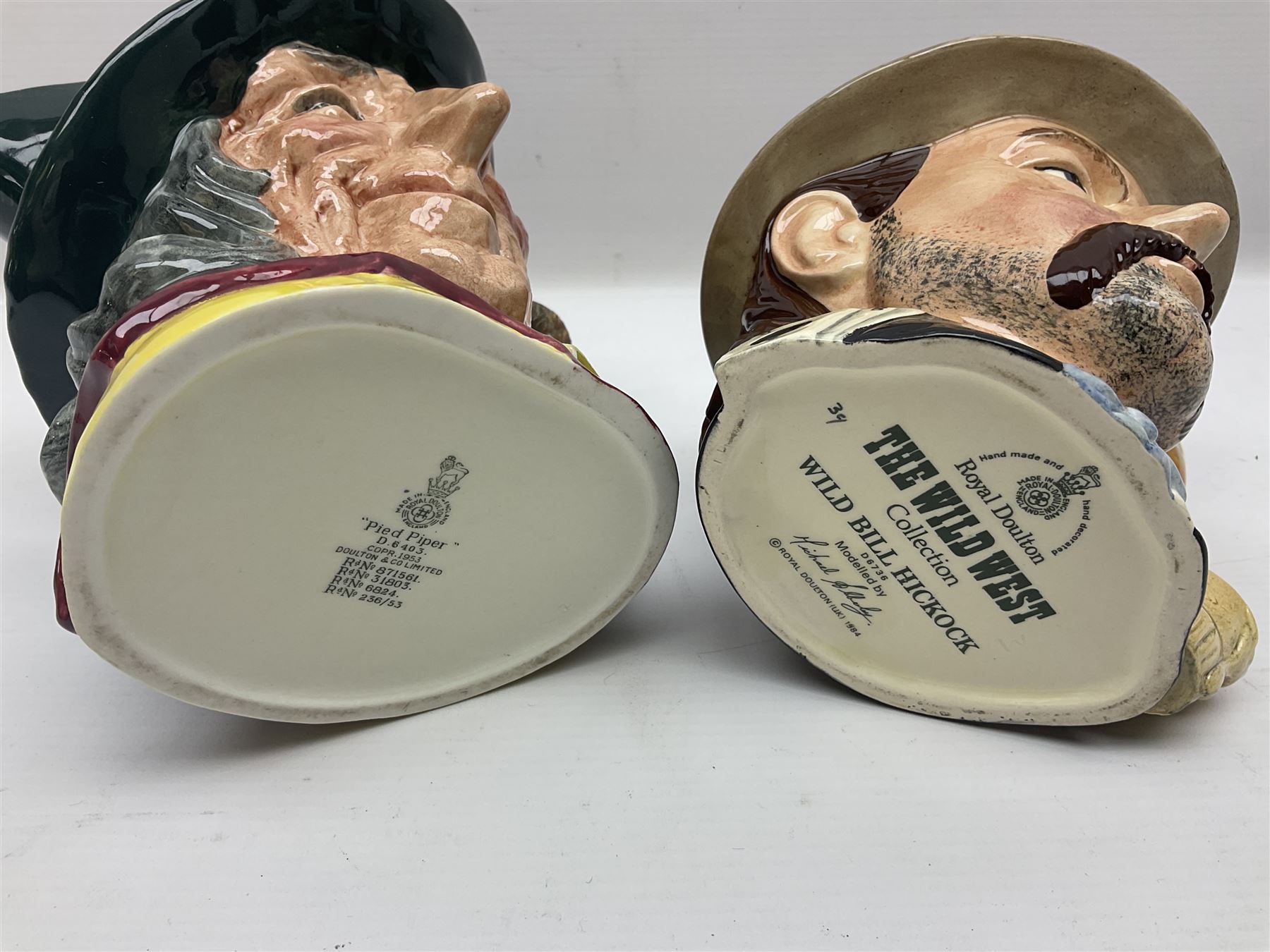 Large collection of Royal Doulton character jugs, to include Robinson Crusoe D6532, Tam O Shanter D6632, The Falconer D6533 etc, together with similar charater jugs and toby jugs   