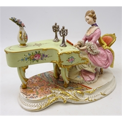  Capodimonte figure of a lady playing the piano, signed D. Belliou, L27cm   
