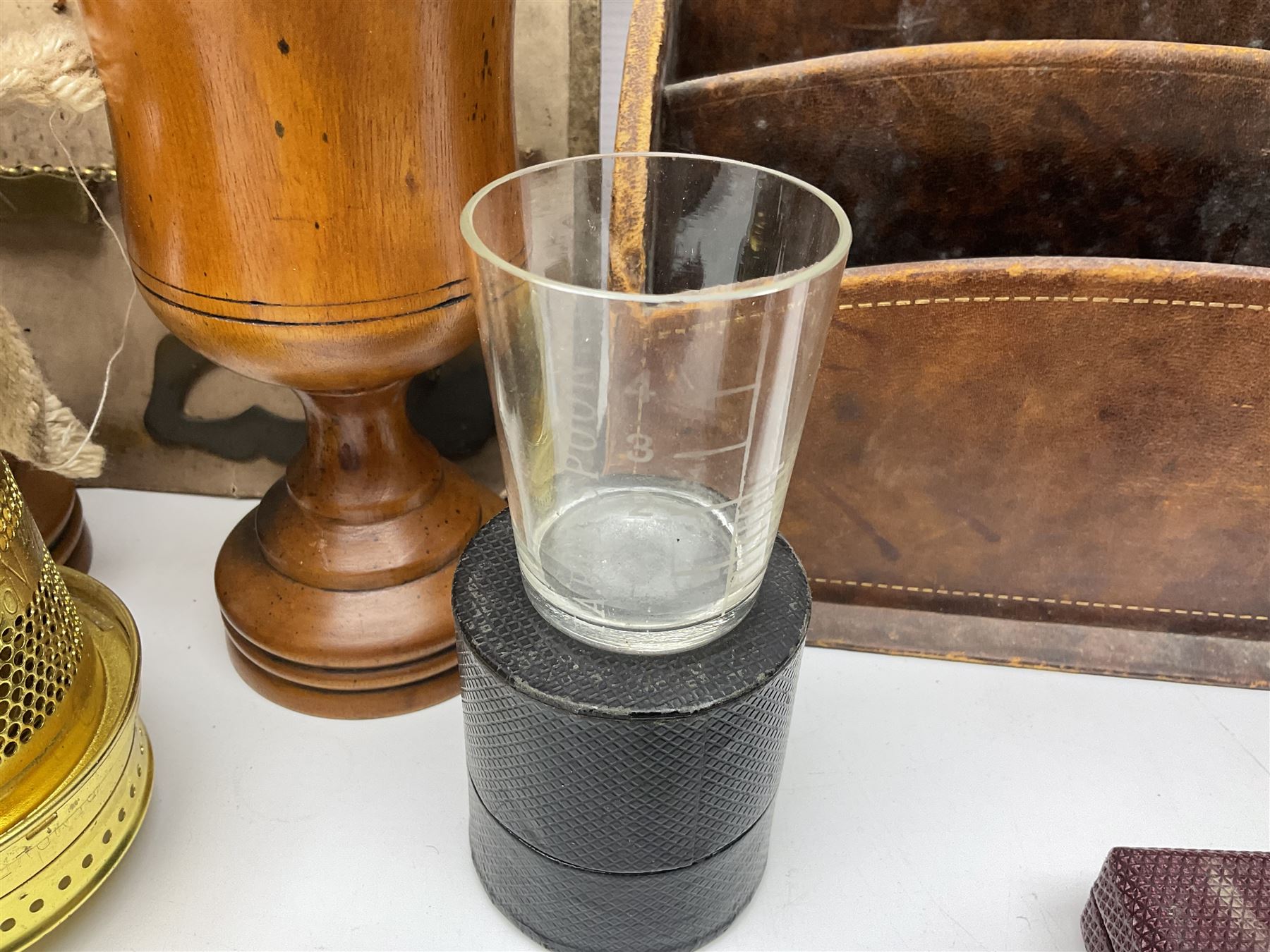 Pair of turned wooden goblets, six hardstone eggs, vintage slide rule and a leather letter rack, etc