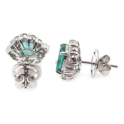  Pair of 18ct white gold oval emerald, baguette and round brilliant cut diamond cluster stud earrings, stamped 750, emeralds approx 2.1 carat, diamonds approx 1.1 carat  