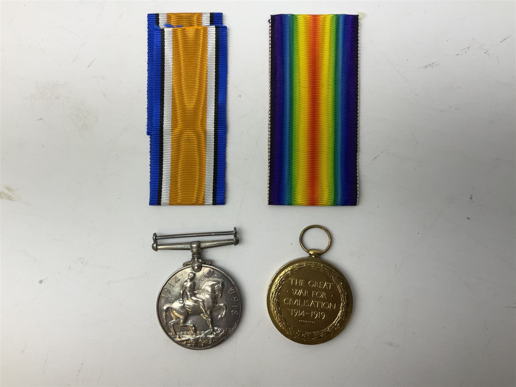 WW1 group of three medals comprising British War Medal and Victory Medal in issue box and Ceylon Volunteer Service Medal awarded to 10288 Pte. M. Smith R. Fus.; together with a later awarded WW2 Defence Medal in modern box with slip; and his QEII Imperial Service Medal in case and box with certificate dated 1959