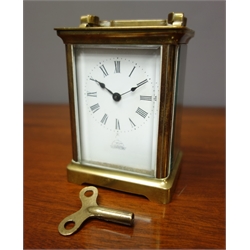  Early 20th century brass carriage clock in leather travelling case  