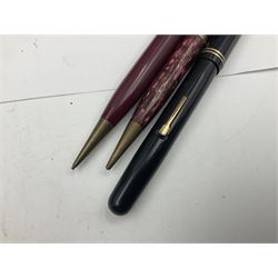 Group of Waterman pens and propelling pencils, to include a fountain pen, the black barrel with rolled gold cap and nib stamped 14ct, together with a matching propelling pencil, in box, together with a further fountain pen with gold nib stamped 14ct, stainless steel fountain pen and rollerball set in box, propelling pencil with maroon barrel etc, largest L13cm (7)