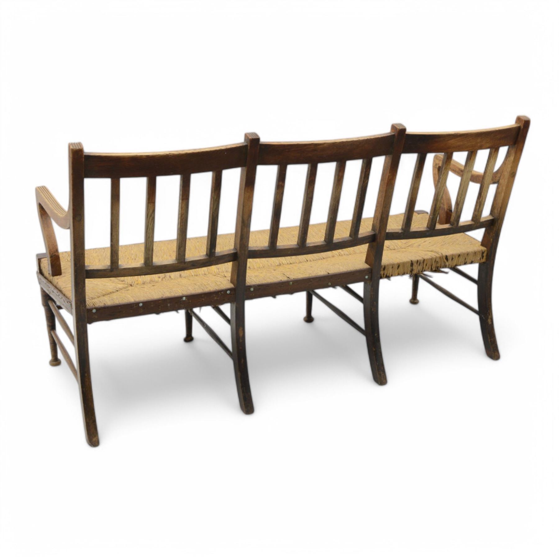 Liberty & Co. London - circa. 1890s ‘The Wykeham’ settle or bench, reeded frame and rush seat, on turned supports united by turned stretchers

The promotional sketch for ‘The Wykeham’ range can be seen in the ‘Liberty & Co. Handbook of Sketches, 1889’ p.49. It is also reproduced in Daryl Bennett’s ‘Liberty’s Furniture 1875-1915 […]’ p.106. Referred to as ‘The Wykenham: ‘oaken furniture’’. See images. 

