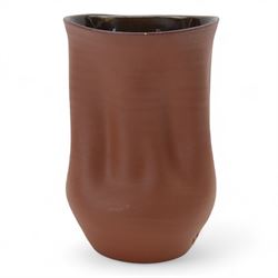 Nicholas Arroyave Portela (c1972-): earthenware vase with ribbed and crumpled surface covered in terracotta glaze to the exterior and brown glaze to the interior, impressed NAP mark, H22cm