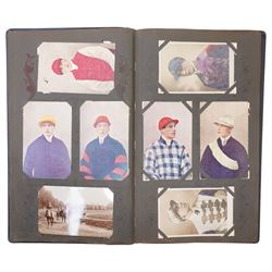 Early 20th century postcard album, belonging to Jockey John Edward (Jack) Leach, born Nov. 1901, with hand coloured pages including twenty two coloured cards from the Jockey Series, silhouette card signed F Winter, other jockey and racing cards, fox hunting, seven Racing Pigeon cards etc (141)