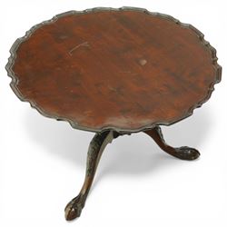 Late 19th century mahogany piecrust occasional table, circular top with scalloped moulded edge, on a turned pedestal with carved cabriole supports terminating in claw and ball feet