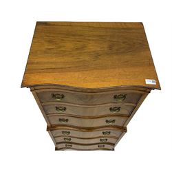 Burton Reproductions walnut chest on chest, fitted with six serpentine drawers
