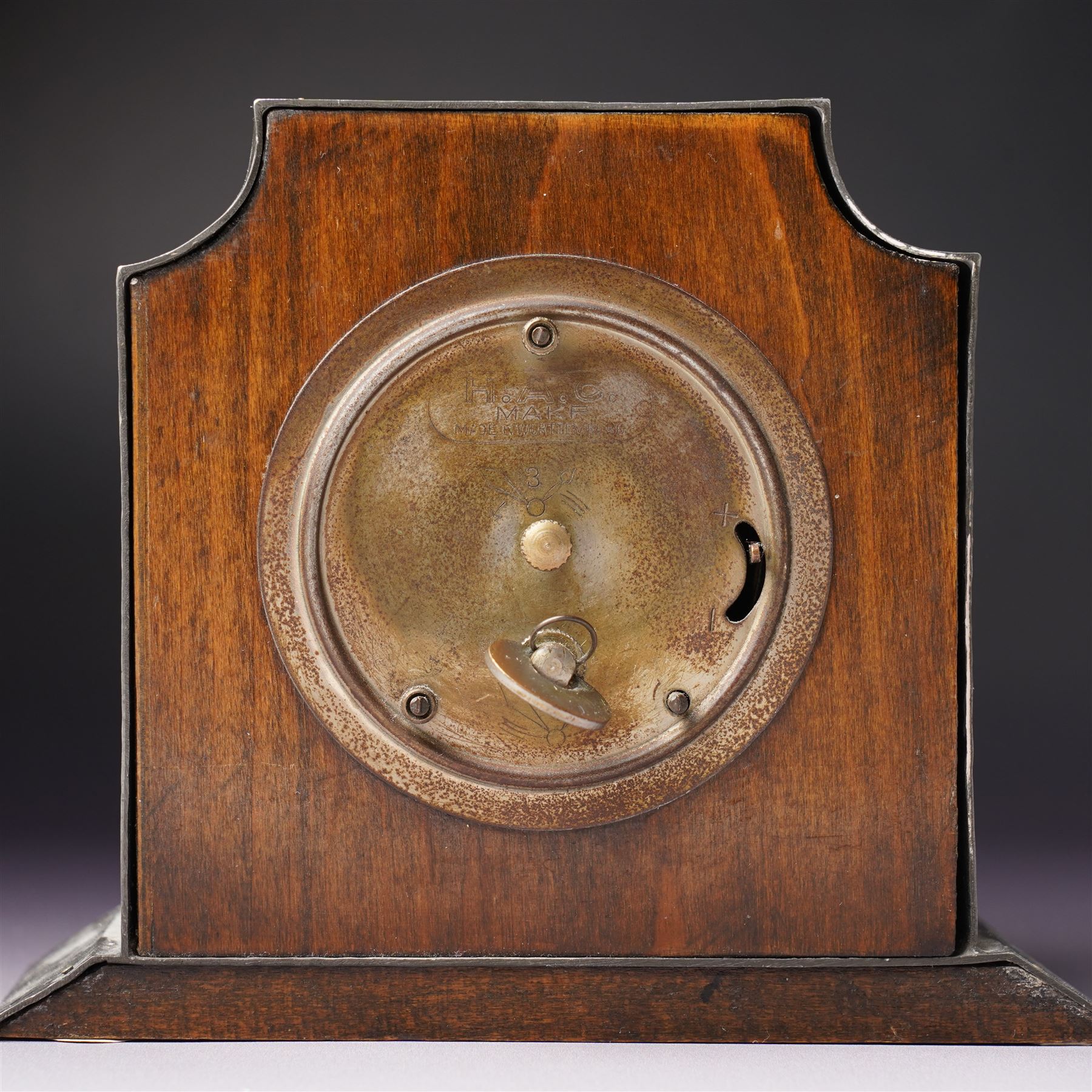 Arts and Crafts planished pewter mantel clock, possibly Tudric for Liberty & Co, with inlaid blue enamel in the form of two leaves, apparently unmarked, 11.5cm 