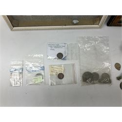 Collection of metal detecting finds, most contained within display frames and labelled, some loose, to include musket balls, bill hook, axe fragment, hubcaps, shell cases, regimental badges, coins, etc. 