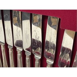 Canteen of silver plated cutlery for six plate settings by Dixons, within fitted wooden case, together with a meat fork with embossed silver handle, silver teaspoon and a silver straining spoon