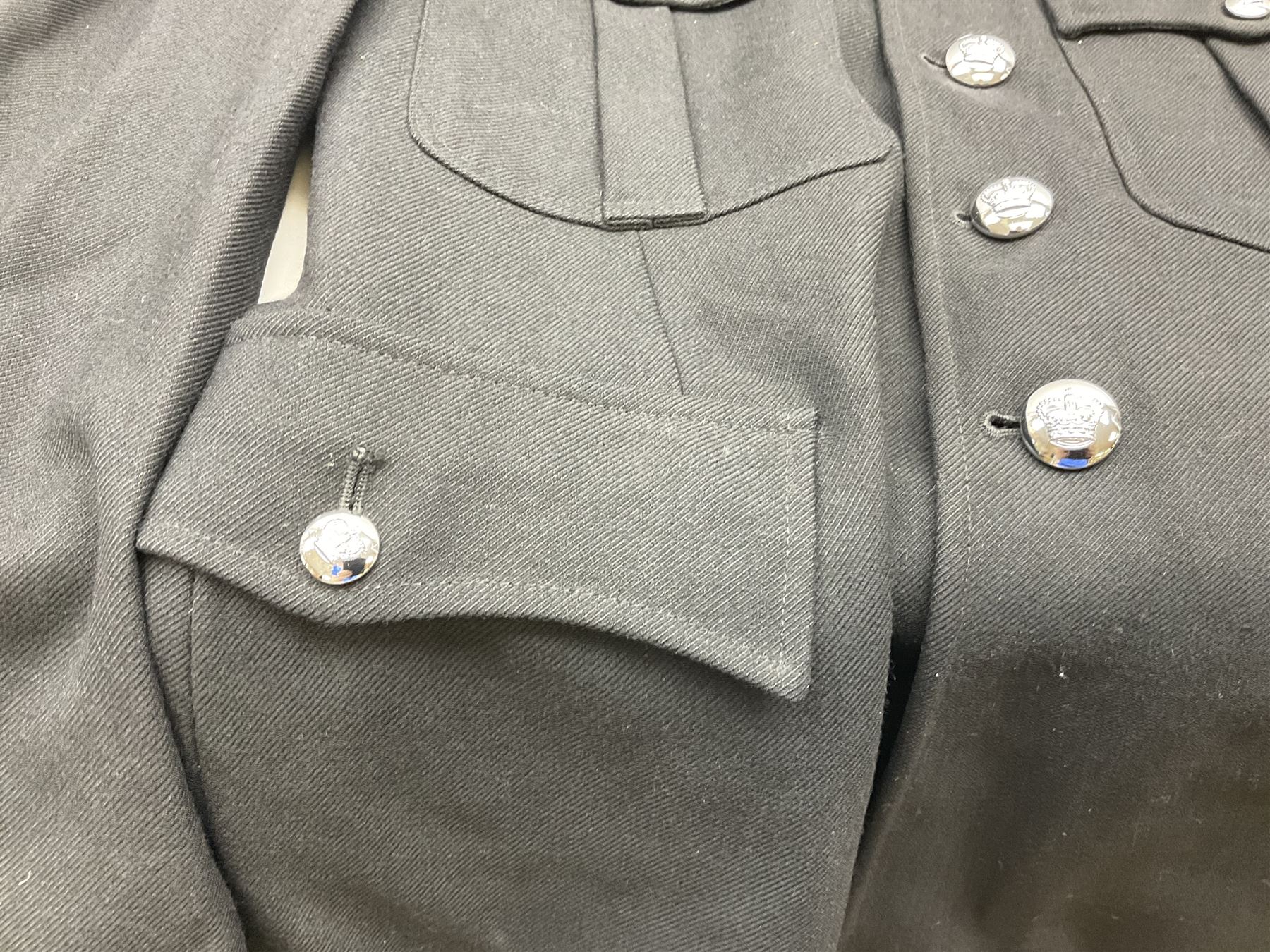 LNER Police cape; indistinctly dated 1943(?); York & North East Yorkshire Police belted tunic; belted tunic with Chief Constable epaulettes and buttons; and another tunic with staybrite Queens Crown buttons (4)