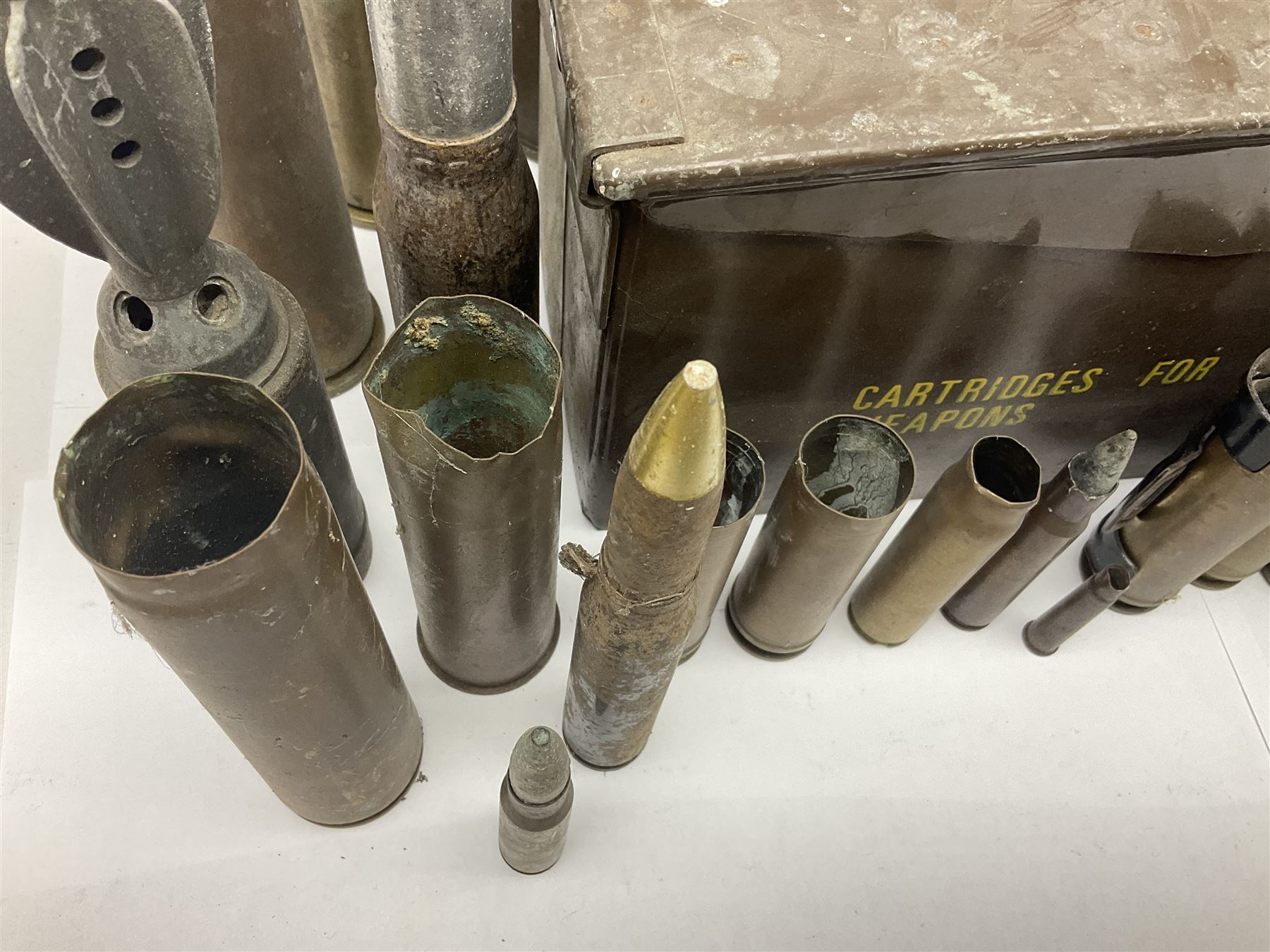 Large collection of shell and bullet casings, including a trench art example, together with a metal cartage case and wooden case