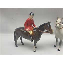 Beswick hunting group, comprising huntswoman on grey horse no 1730, huntsman on brown horse no 1501, fox figure no 1440 and eight fox hounds, all with printed marks beneath (11)