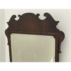 George II walnut mirror, shaped fretwork frame with moulded inner slip, bevelled plate