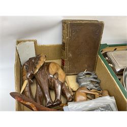 Two family bibles, together with a collection of silverplate, carved wooden animals and other collectables, in three boxes 
