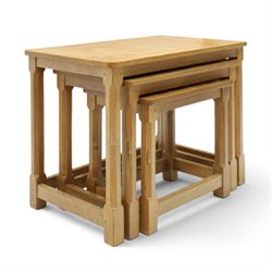 Mouseman - nest of three oak occasional tables, rectangular adzed top, on octagonal supports united by plain stretchers, each carved with mouse signature, by the workshop of Robert Thompson of Kilburn