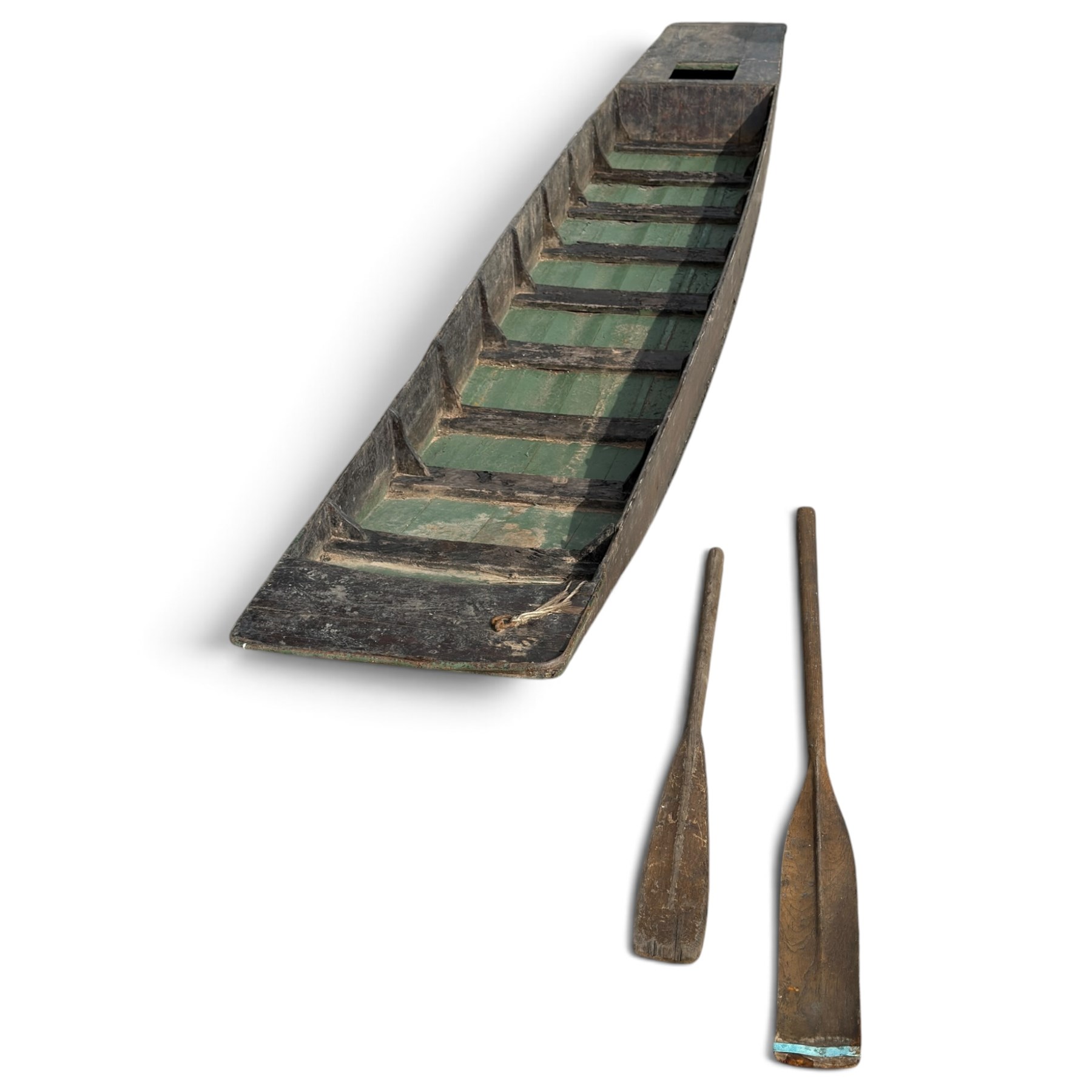 Large early 20th century plank-built wooden river punt, the long tapering hull with enclosed fore and aft decks, open green-painted ribbed interior, together with two paddles
