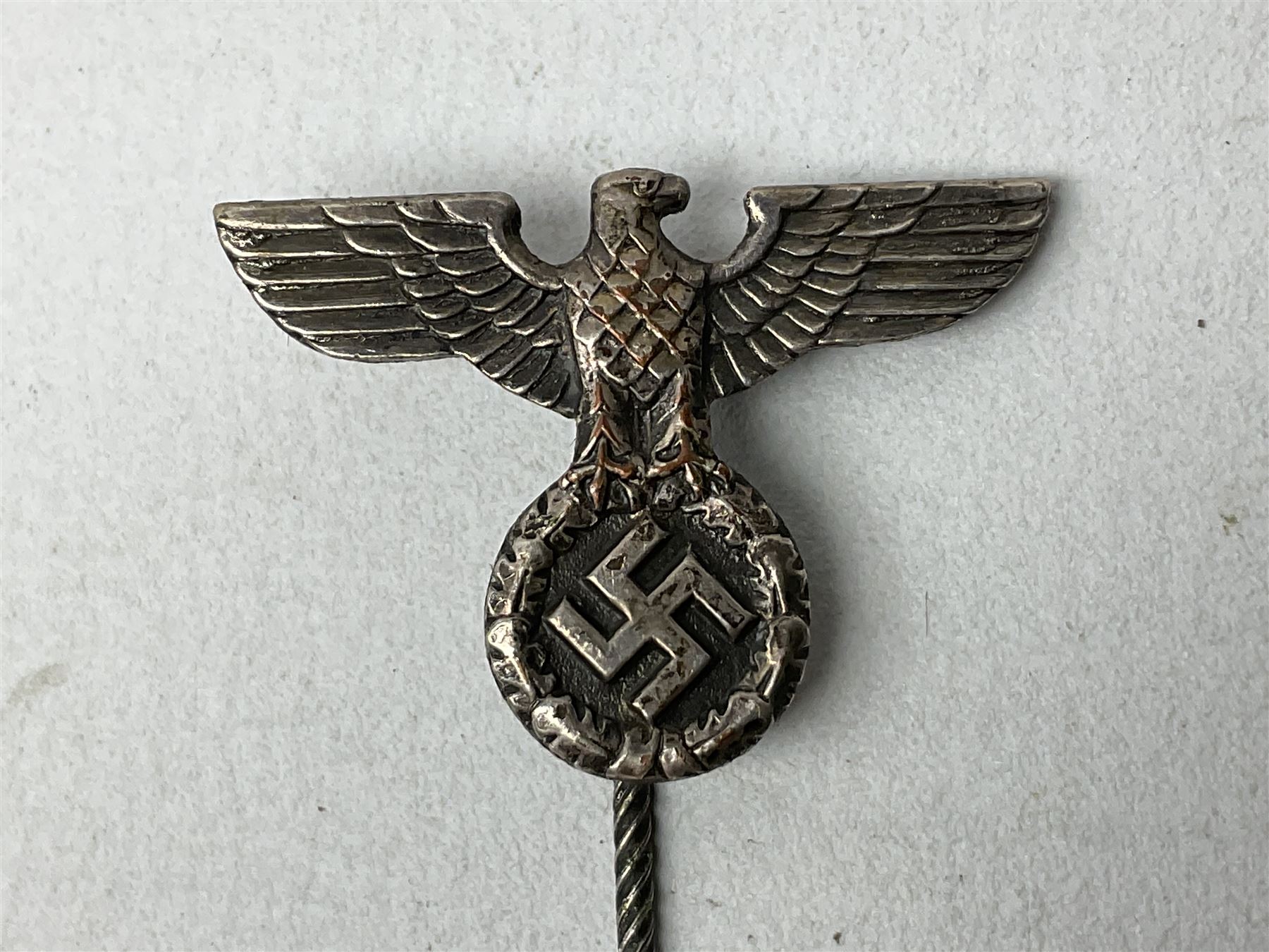 Nine WW2 German lapel pins including five Infantry Assault, Tank