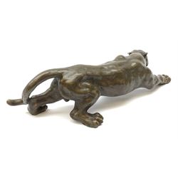 A bronze figure, modelled as a cougar in crouching pose, signed Milo and with foundry mark, L40cm. 