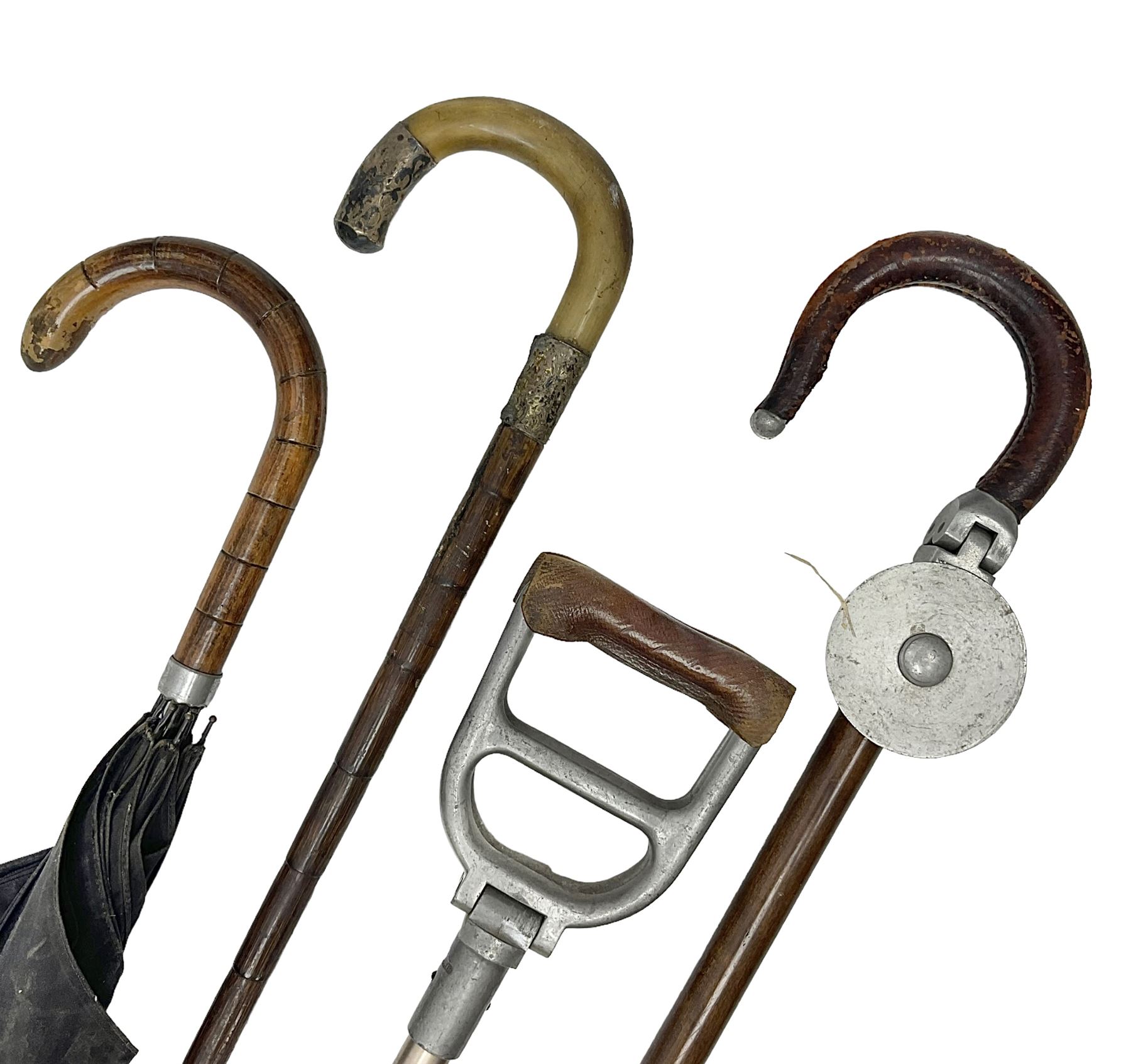 Early 20th century curved horn handle walking stick with hallmarked silver mounts, engraved L Russell 1918, together with a shooting stick by William Mills Birmingham, with leather handle, 'The Featherwaite' shooting stick and an umbrella with wooden handle