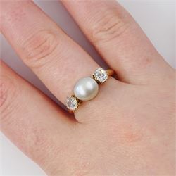 Early 20th century 15ct gold pearl and diamond three stone ring, single grey pearl with an old cut diamond set either side, total diamond weight approx 0.55 carat