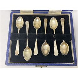 Small group of silver, comprising cased set of six coffee spoons, pair of sugar tongs, and napkin ring, all hallmarked, approximate total silver weight 71 grams