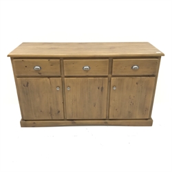  Solid pine dresser base, three drawers above three cupboard doors, two slides to side, shaped plinth base, W140cm, H81cm, D46cm  