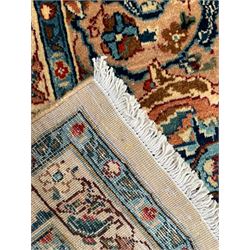 Persian Kashmar camel ground carpet, palmette rosette medallion on a field of curling leafy branches and stylised plant motifs, scrolling border decorated with further palmettes, within floral pattern guard stripes