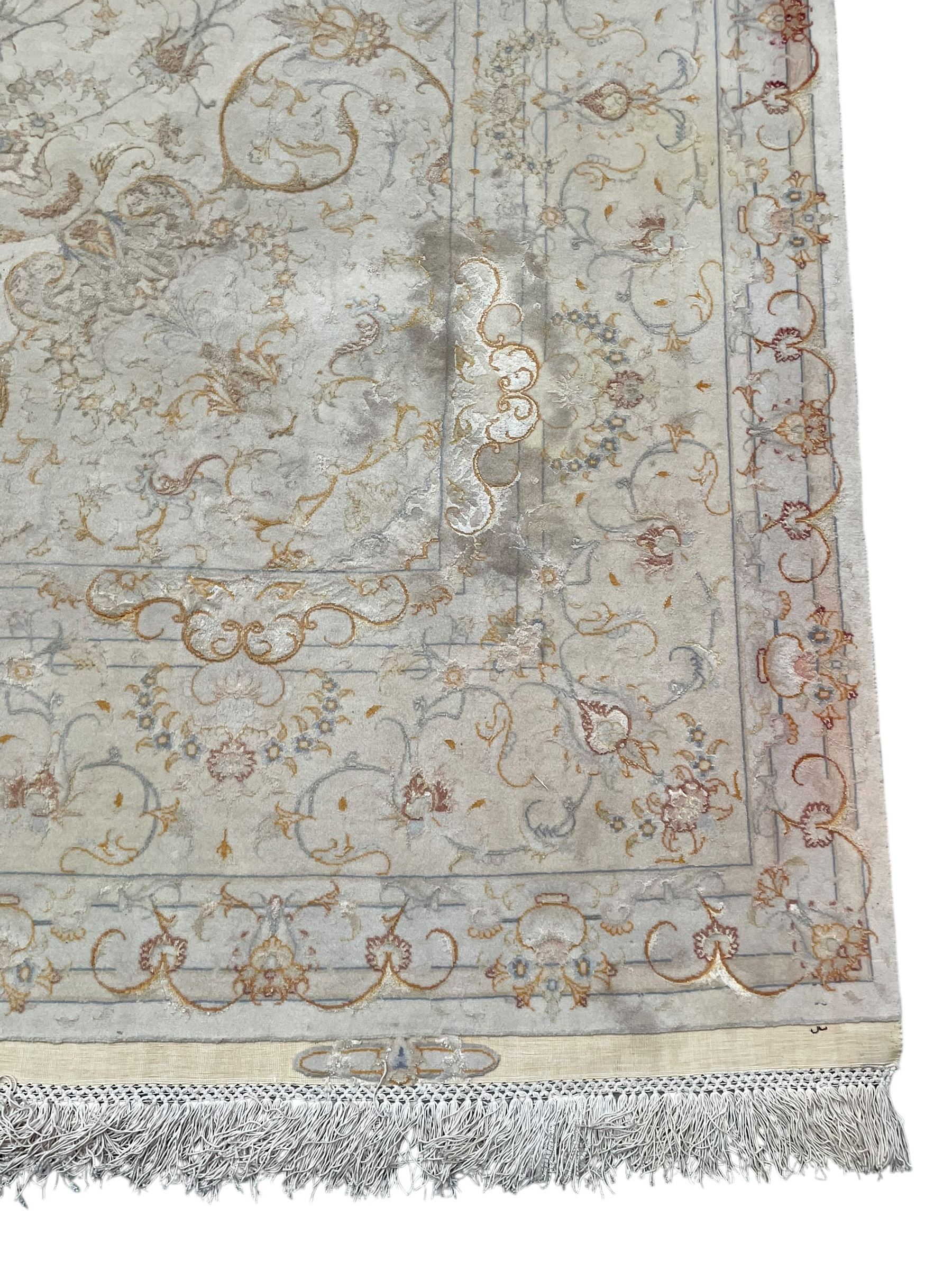 Persian Mahal densely knotted ivory ground carpet, floral rosette medallion surrounded by interlacing leafy branches and palmettes, scrolling border decorated with foliate motifs, within guard stripes, with signature panels to each end