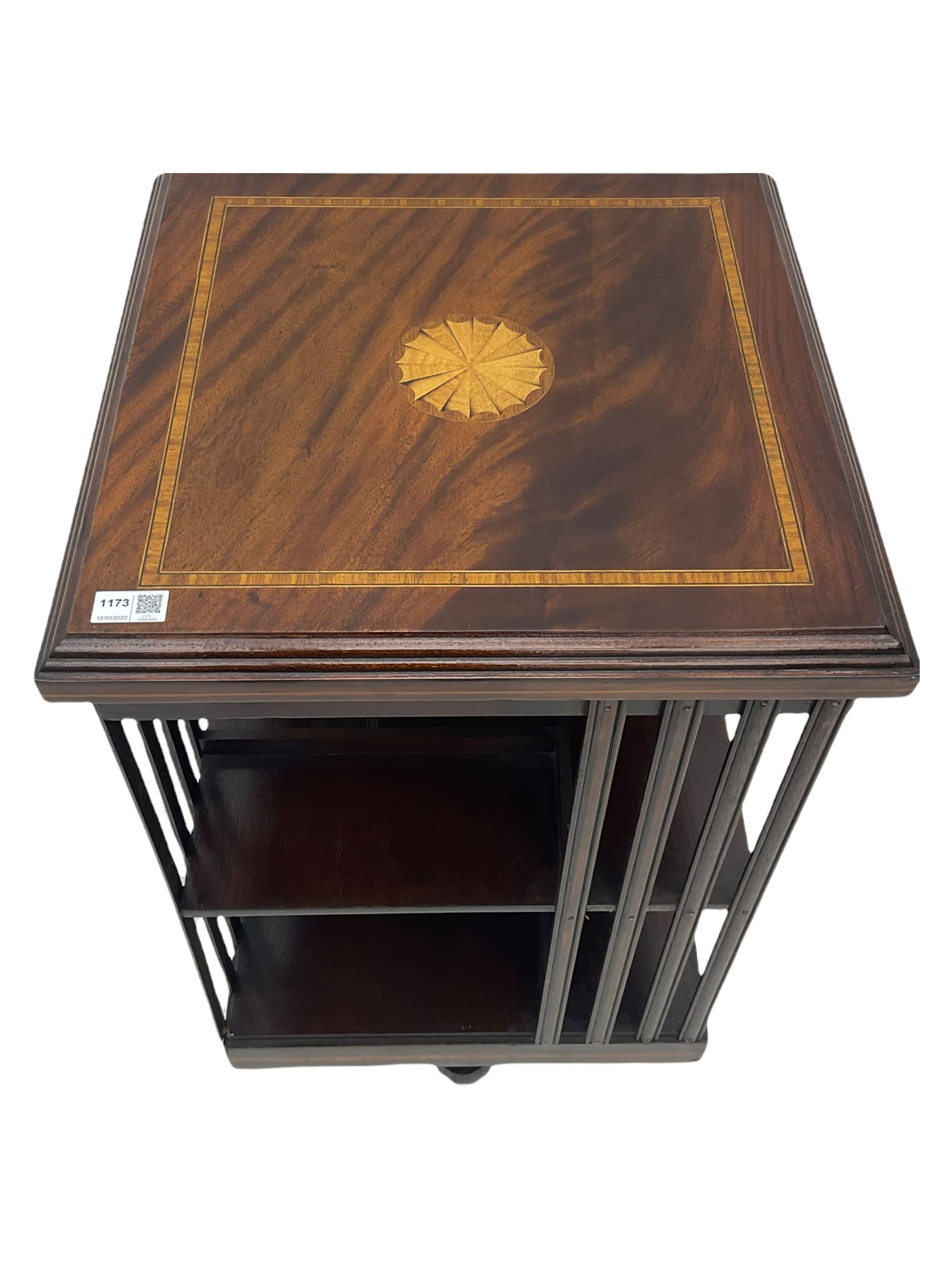 20th century mahogany revolving bookcase, inlaid centre motif, satinwood banded border