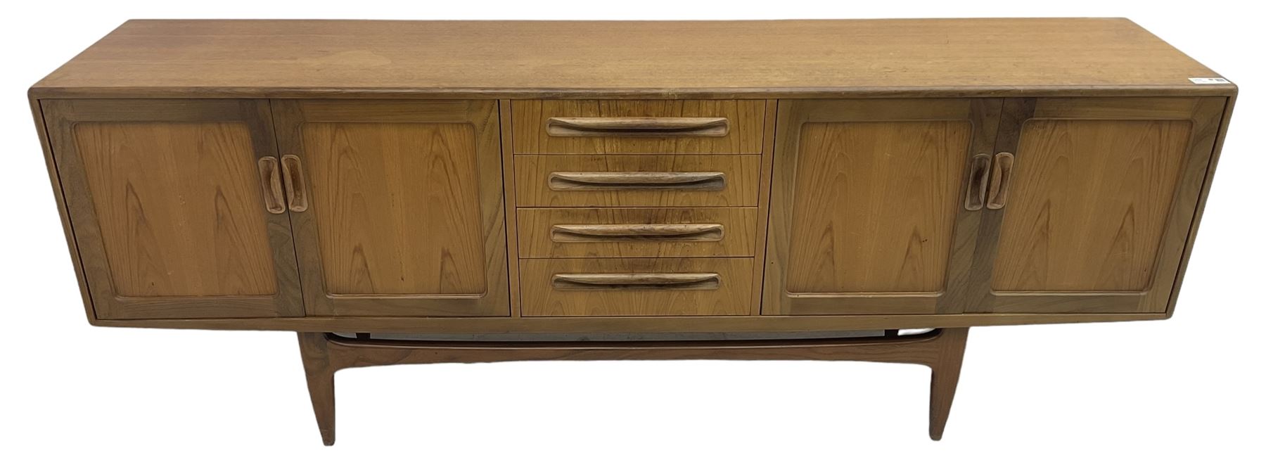 G-Plan – teak sideboard, four central drawers flanked by two double cupboards, enclosed by panelled doors 