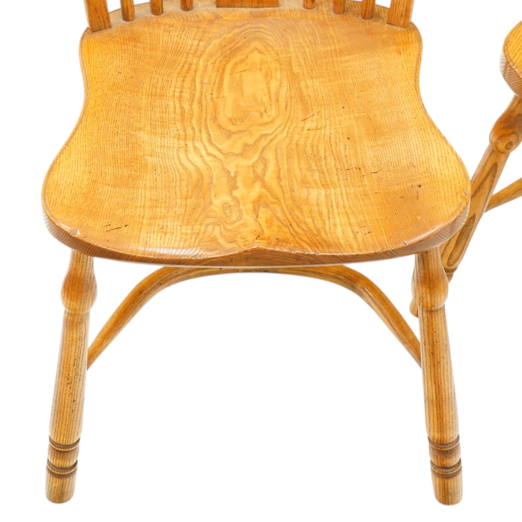 Quality set of six (4+2) golden figured and burr oak Windsor chairs, the yoke-shaped cresting rail over a vasiform shaped splat and spindle back, shaped saddle seat raised on turned supports united by crinoline stretcher