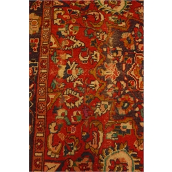  Persian Hamadan red ground rug, overall stylised floral design with blue central medallion, 204cm x 152cm  
