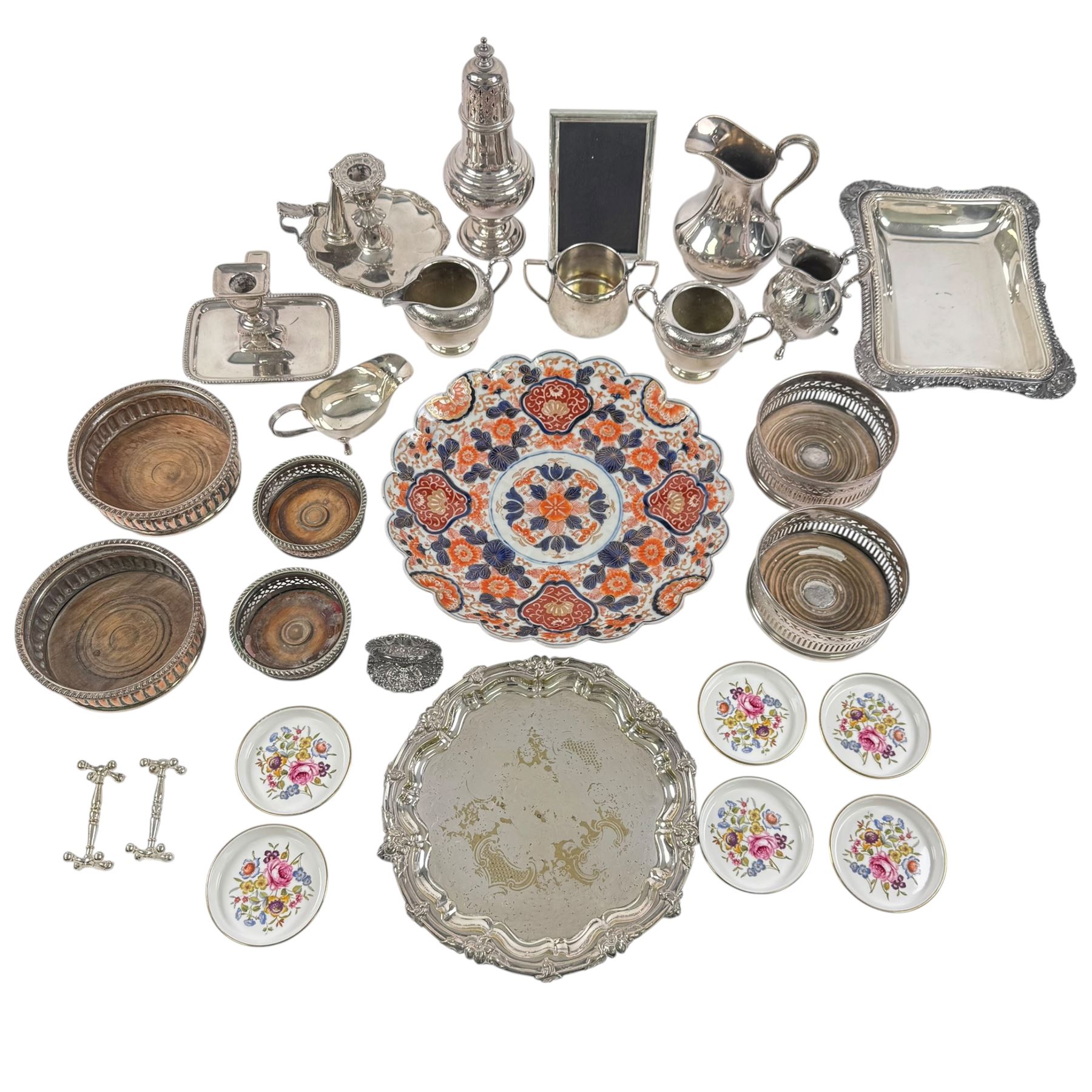 Silver plated items, including thee pairs of bottle coasters, sugar caster, Elkington jug, chamberstick etc and a Japanese Imari scalloped charger
