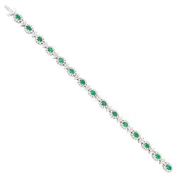18ct white gold emerald and diamond bracelet, fifteen oval cut emeralds, each surrounded b...