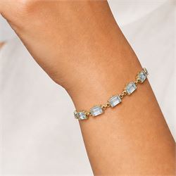 9ct gold Swiss blue topaz bracelet, set with thirteen rectangular cut topaz's, hallmarked