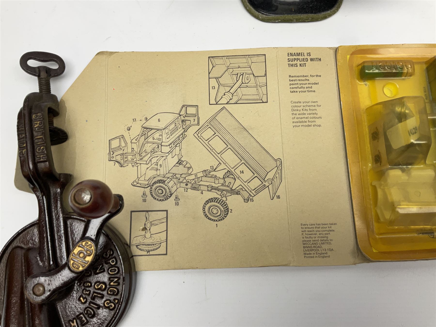 Dinky Kit No.1029 Ford D800 Tipper Truck in unopened original packaging; American Singer child's sewing machine; Spong's table mounting Bean Slicer No.632; and two wall mounting wooden die-cast model open display racks (5)