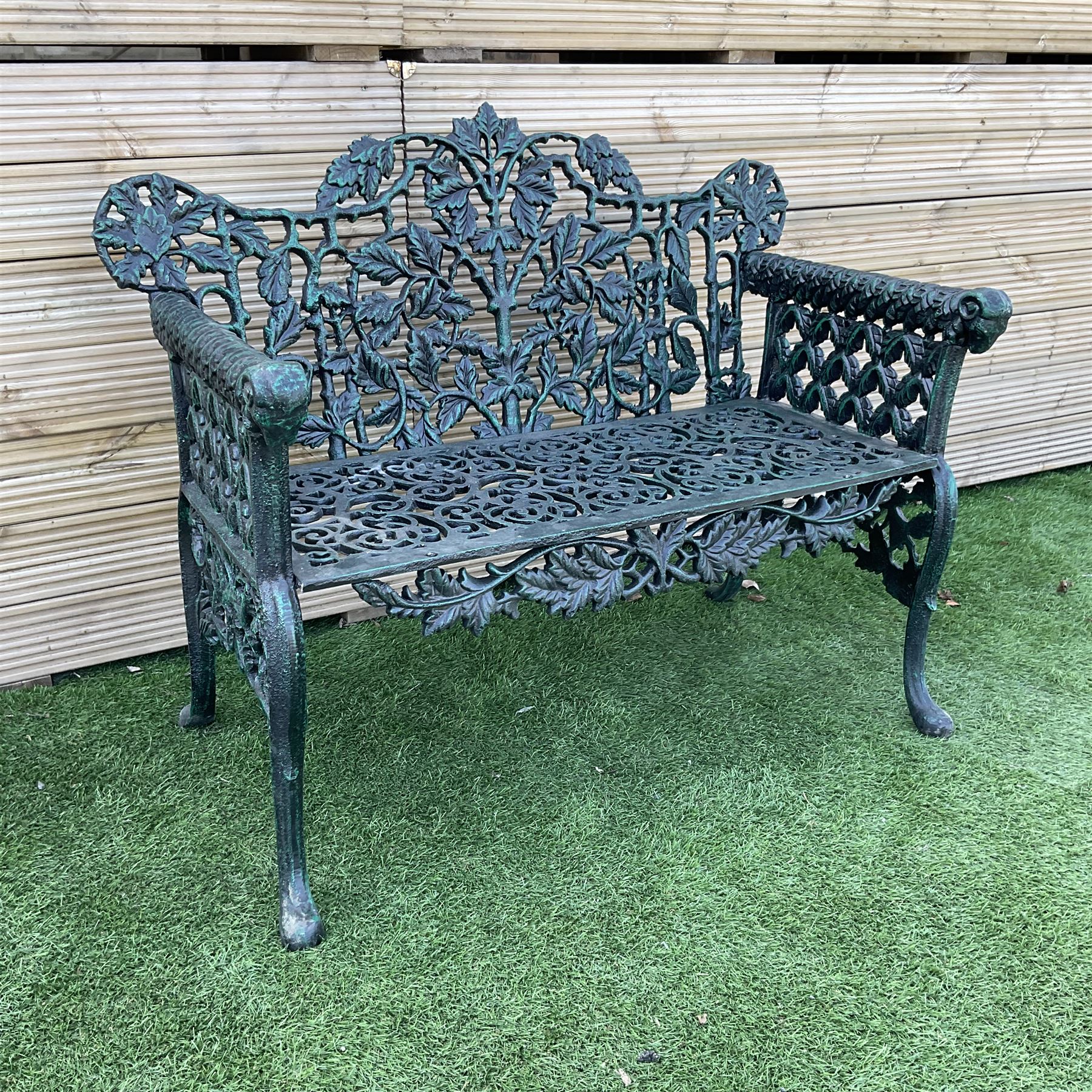 Victorian design heavy cast iron garden bench, ornate shaped back with rope twist and ramshead arms H88cm, W100cm - THIS LOT IS TO BE COLLECTED BY APPOINTMENT FROM DUGGLEBY STORAGE, GREAT HILL, EASTFIELD, SCARBOROUGH, YO11 3TX