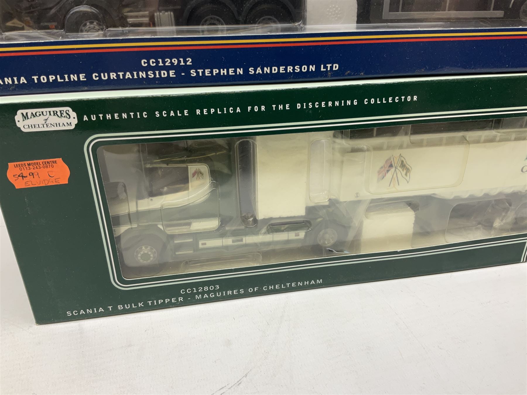 Three Corgi 1:50 scale lorries - ERF Tanker - Gulf Oil in perspex display case No.75101; limited edition Scania T Bulk Tipper - Maguires of Cheltenham No.CC12803; and Scania Topline Curtainside - Stephen Sanderson Limited No.CC12912; all boxed (3)